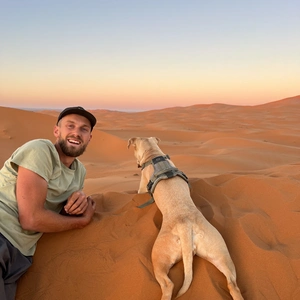 harry and sandy lying down in the saharaa desert